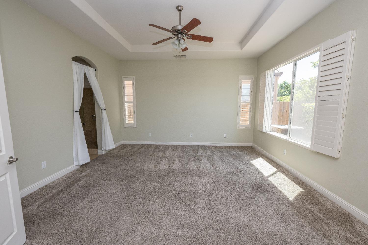 1778 Osmun Avenue Clovis, CA 93619 - Photo 22 of 35 a view of a livingroom with a ceiling fan and window