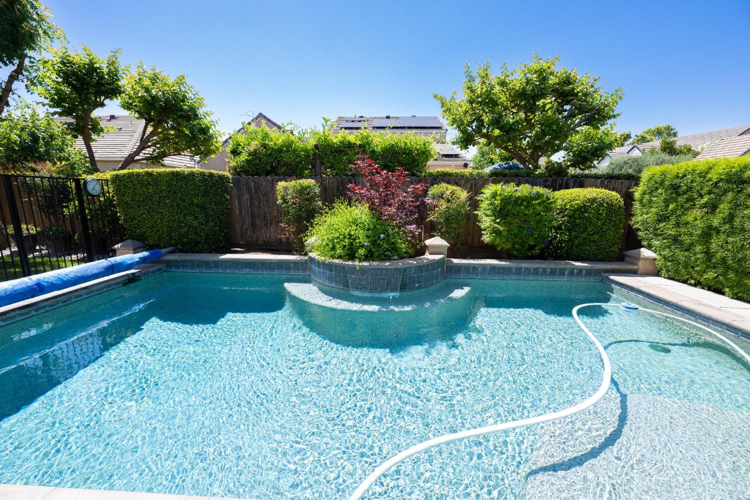 1778 Osmun Avenue Clovis, CA 93619 - Photo 3 of 35 a view of a garden with a bench