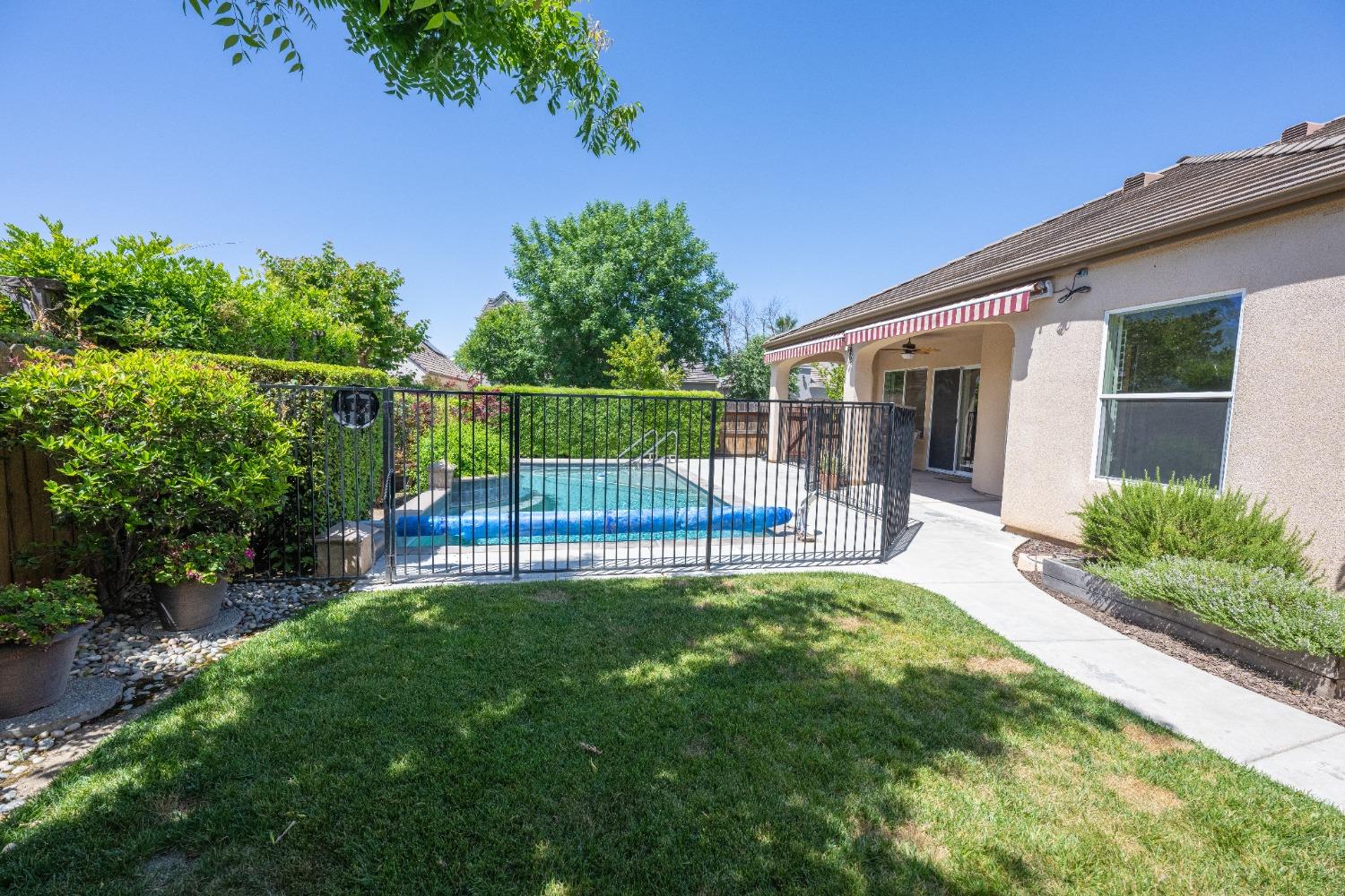 1778 Osmun Avenue Clovis, CA 93619 - Photo 5 of 35 a view of a chair and table in backyard of the house