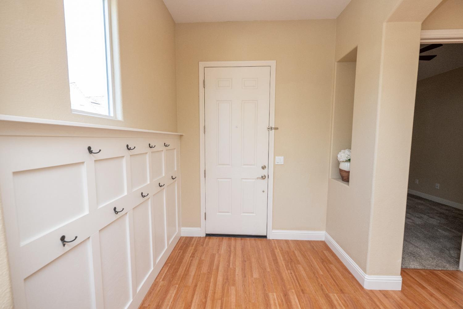 1778 Osmun Avenue Clovis, CA 93619 - Photo 6 of 35 a view of a hallway with wooden floor