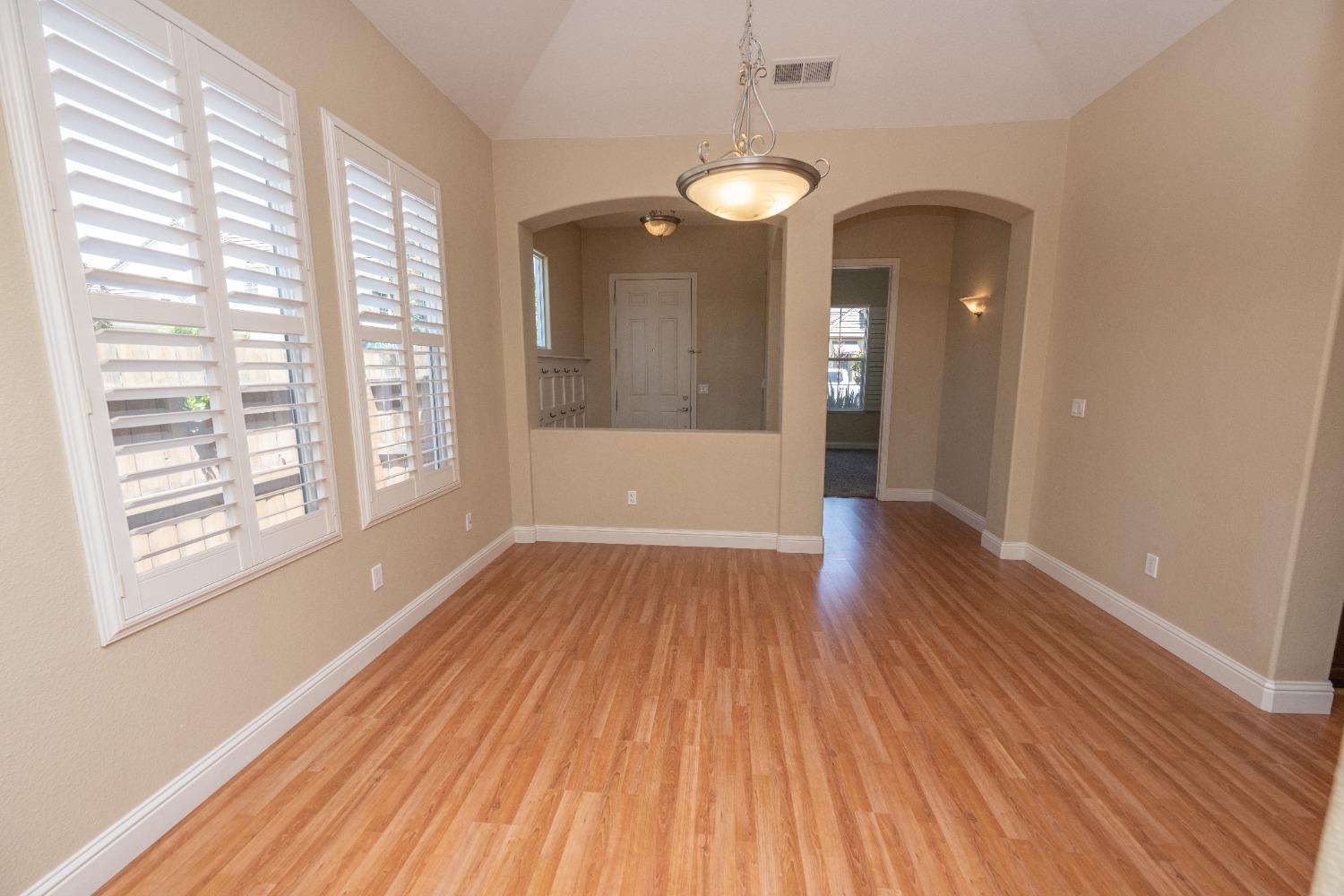 1778 Osmun Avenue Clovis, CA 93619 - Photo 7 of 35 wooden floor in an empty room with a window