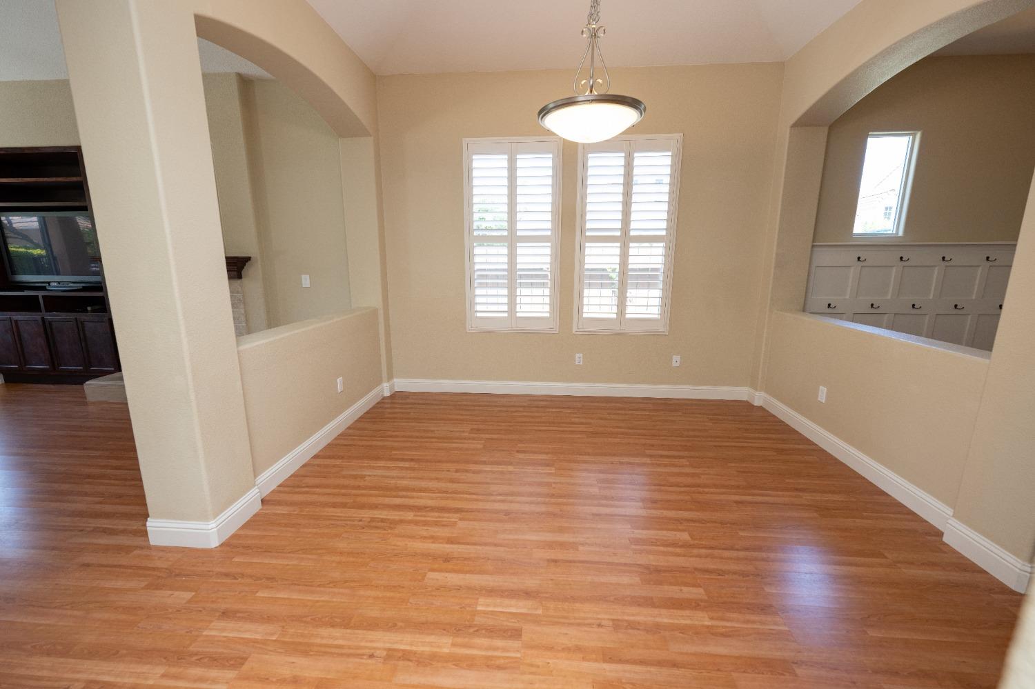1778 Osmun Avenue Clovis, CA 93619 - Photo 8 of 35 a view of empty room with wooden floor and fan