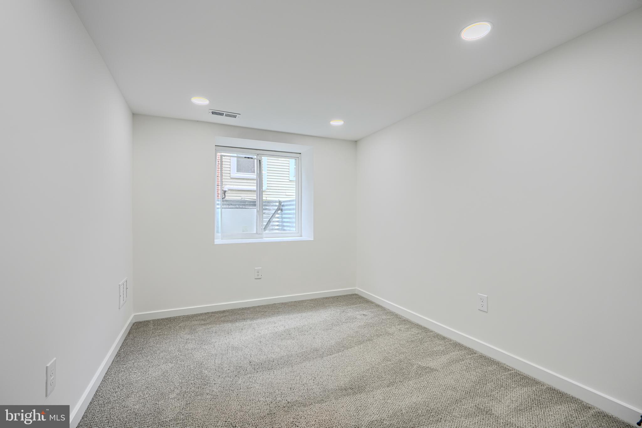 3410 Pinkney Road Baltimore, MD 21215 - Photo 39 of 55 an empty room with a window