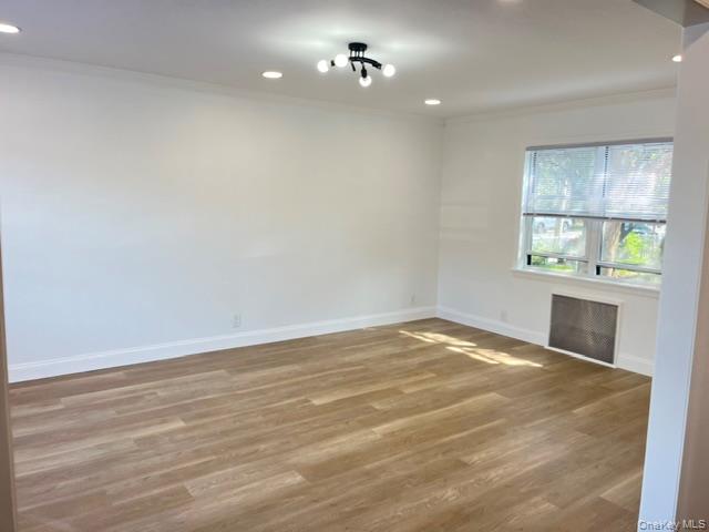 46-05 158th Street Queens, NY 11358 - Photo 10 of 15 a view of an empty room with a window