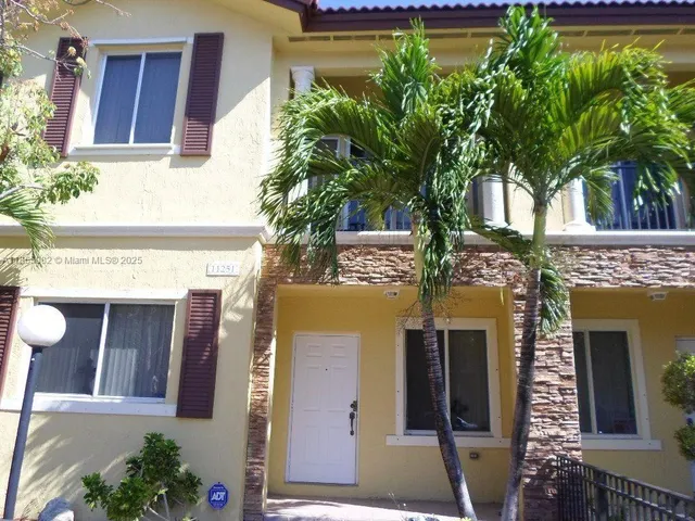 a view of a building with a tree