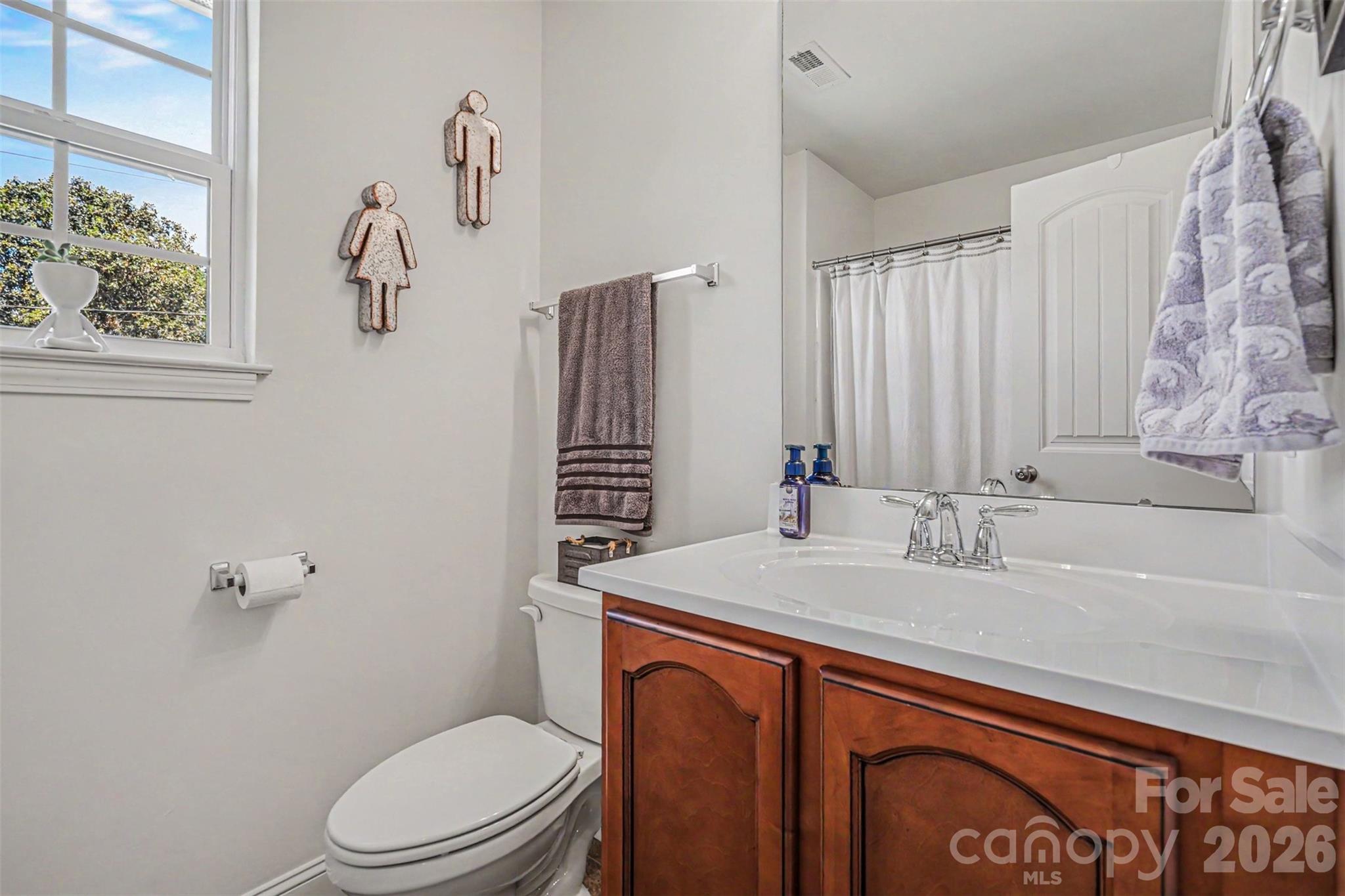 1610 Walter Hasty Road Monroe, NC 28110 - Photo 14 of 32 a bathroom with a granite countertop sink toilet and shower