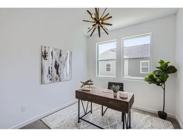 a workspace with furniture and window