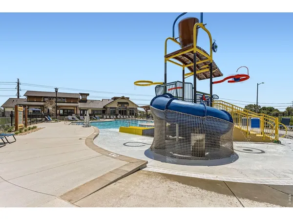 a view of a swimming pool with a slide