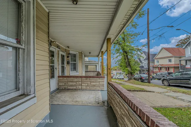 a view of a house with a street