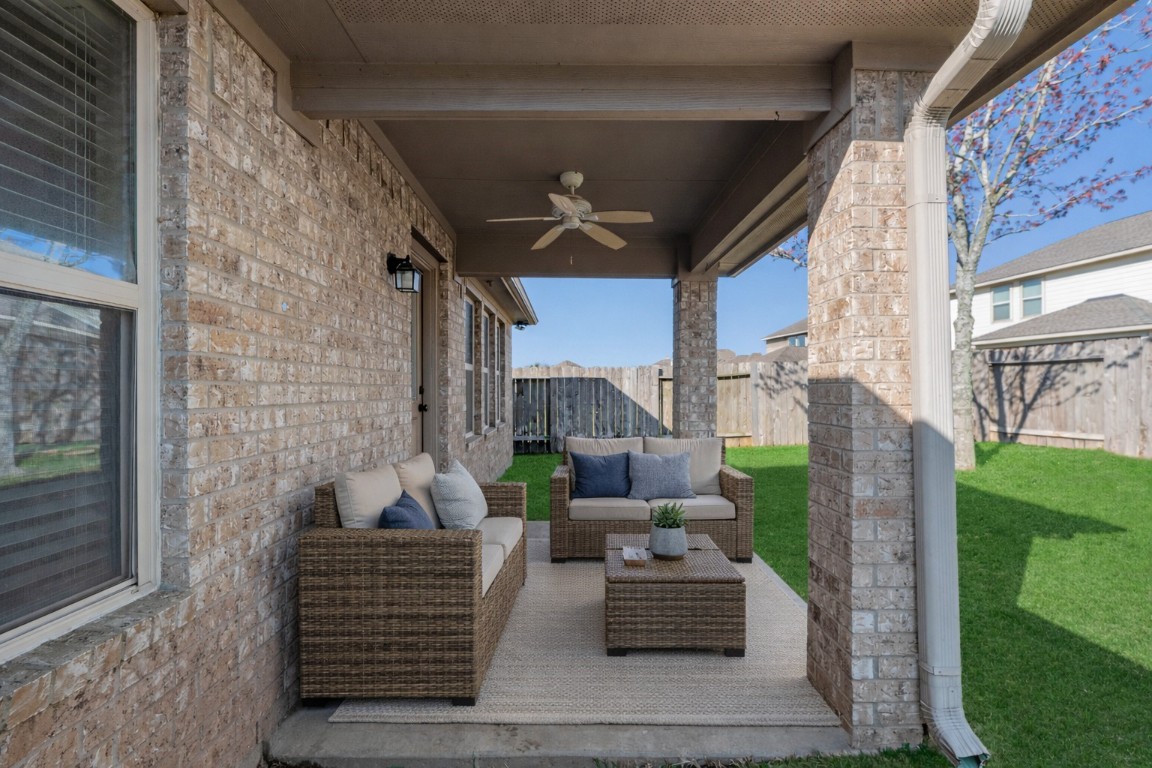 3311 Sabine Spring Lane Katy, TX 77449 - Photo 11 of 16 The covered patio offers plenty of space for a lounge setup or outdoor dining, creating a versatile area to enjoy the backyard. Virtually staged.