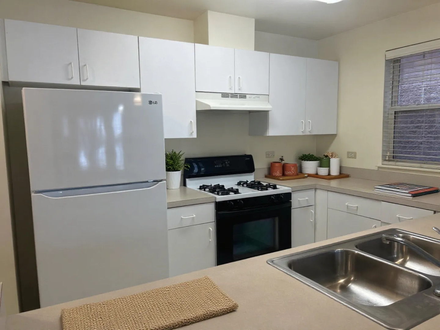 653 West Division Street, Unit B Chicago, IL 60610 - Photo 4 of 13 a kitchen with a refrigerator sink and cabinets