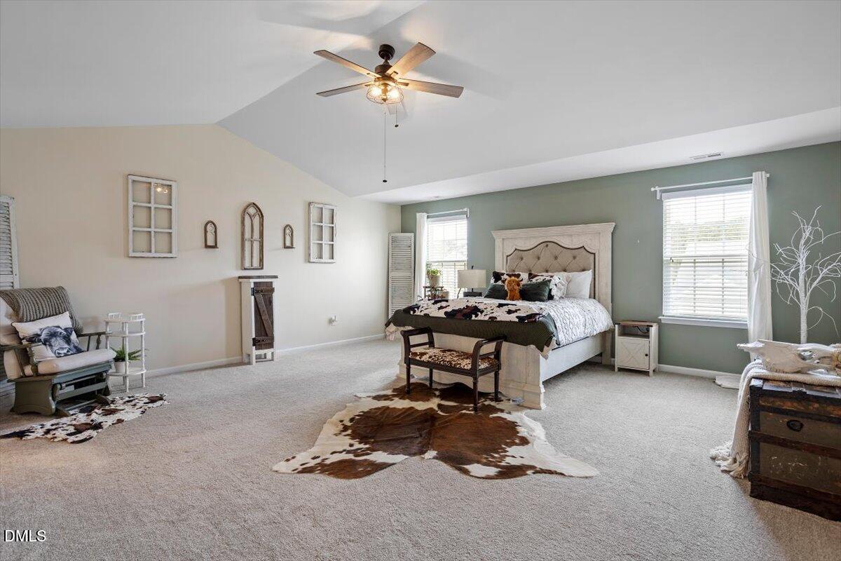 205 Battery Way Bunnlevel, NC 28323 - Photo 24 of 37 a living room with furniture gym equipment and a window