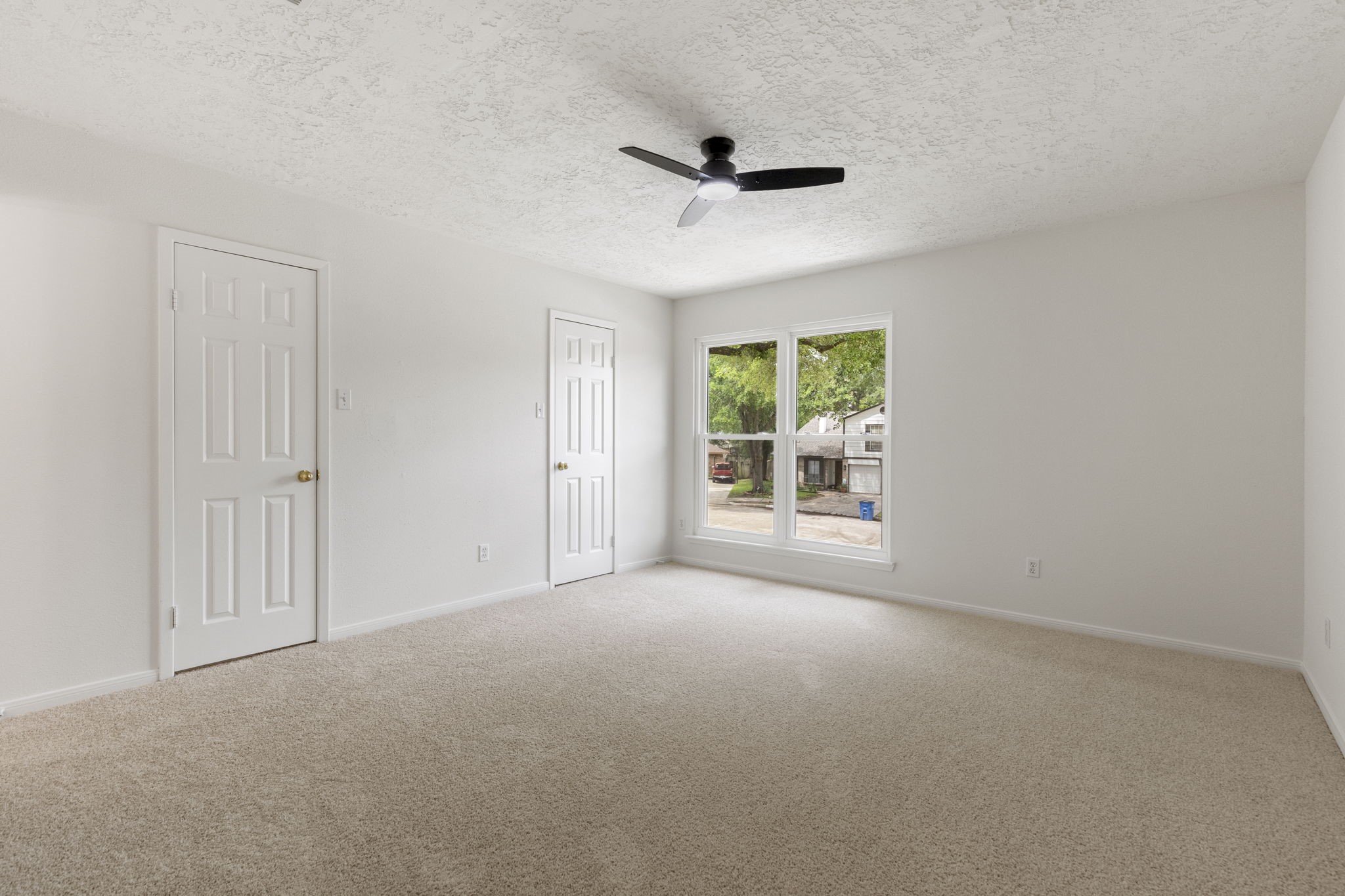 4715 Towermont Lane Spring, TX 77388 - Photo 15 of 35 The primary bedroom is privately tucked away and boasts brand new carpet, paint and ceiling fan.