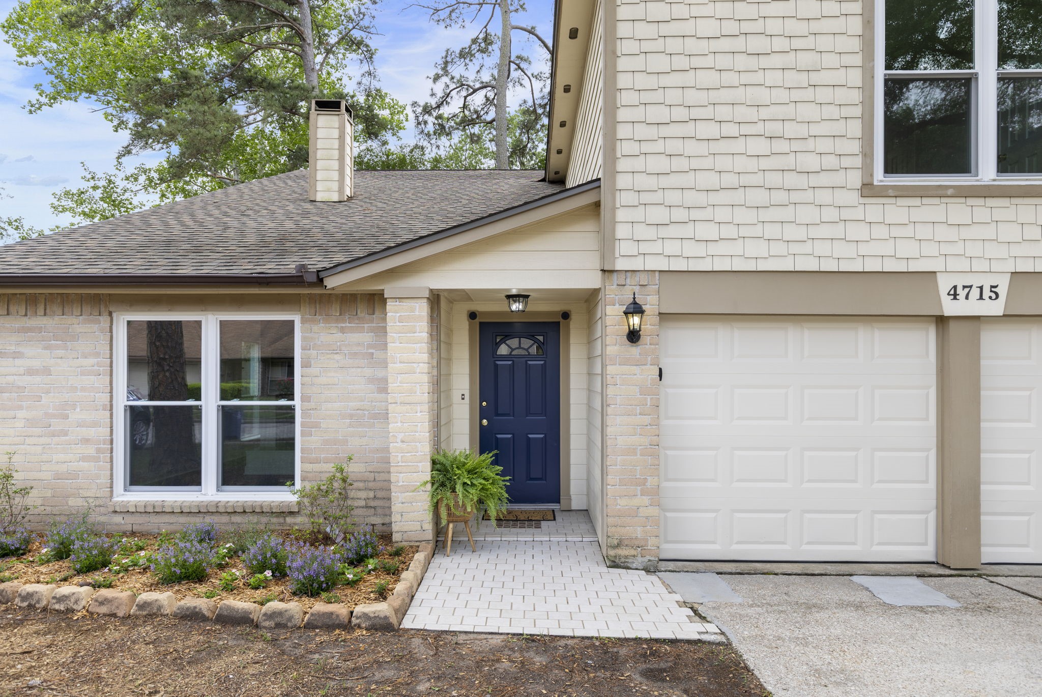 4715 Towermont Lane Spring, TX 77388 - Photo 2 of 35 New flower bed and tiled walk-way greet your family and friends to the covered porch.