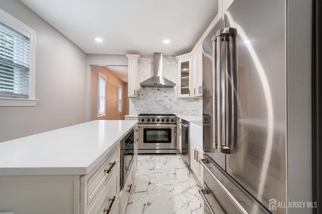 a kitchen with a stove and a refrigerator