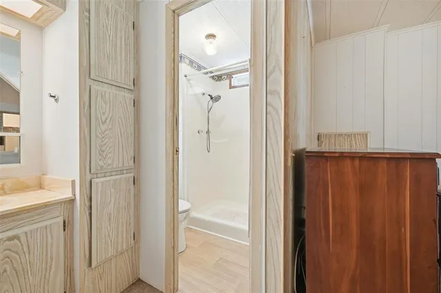 a white toilet sitting next to a bathroom