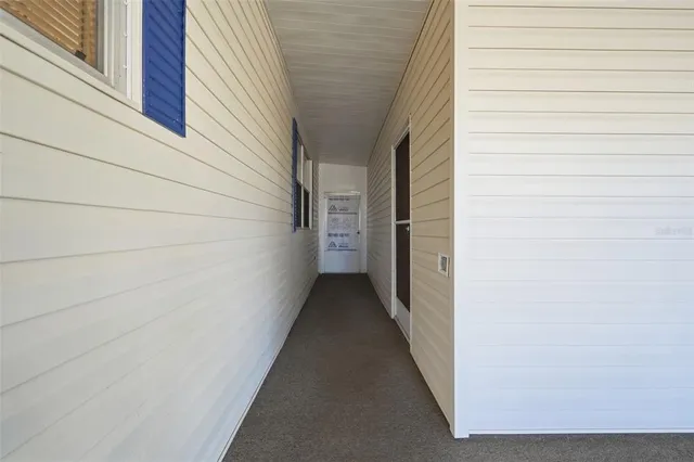 a view of a lake with couches in front of house