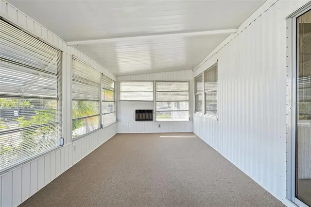 a view of a house with backyard and porch