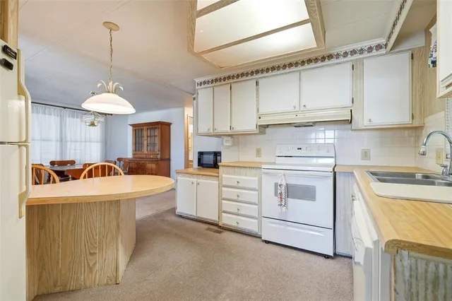 a very nice looking dining room with a table and chairs