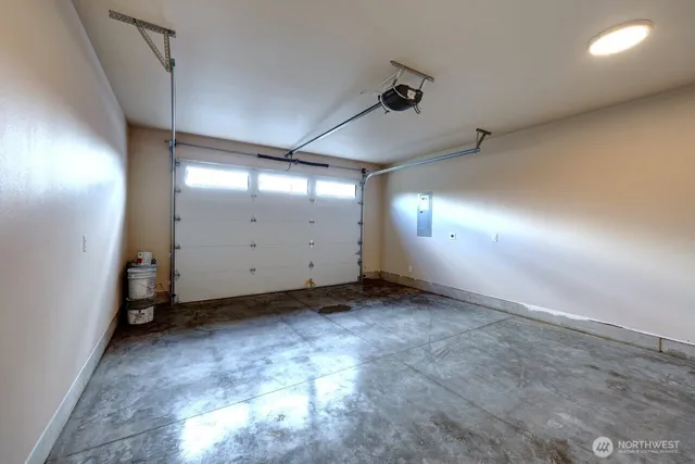 a view of storage and utility room with two windows