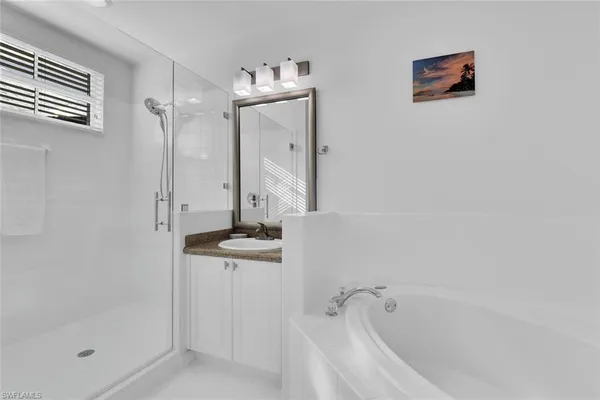 a bathroom with a bathtub and shower