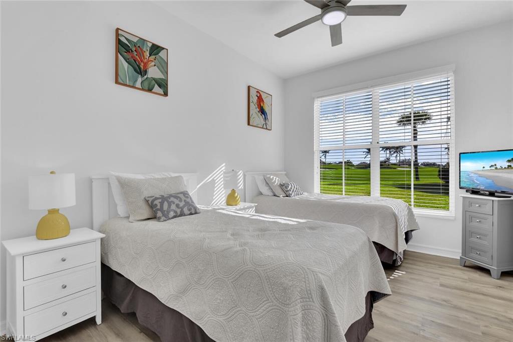 7895 Mahogany Run Lane, Unit 1416 Naples, FL 34113 - Photo 23 of 38 a bedroom with a bed and a window