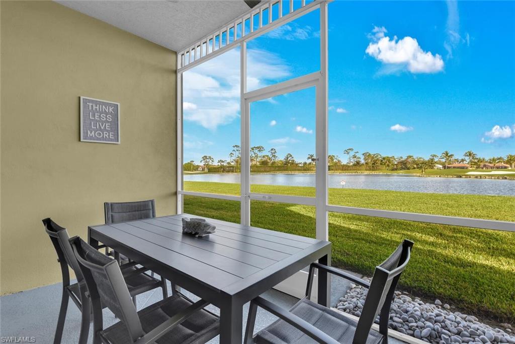 7895 Mahogany Run Lane, Unit 1416 Naples, FL 34113 - Photo 25 of 38 a view of a dining room with furniture a chandelier and a large window