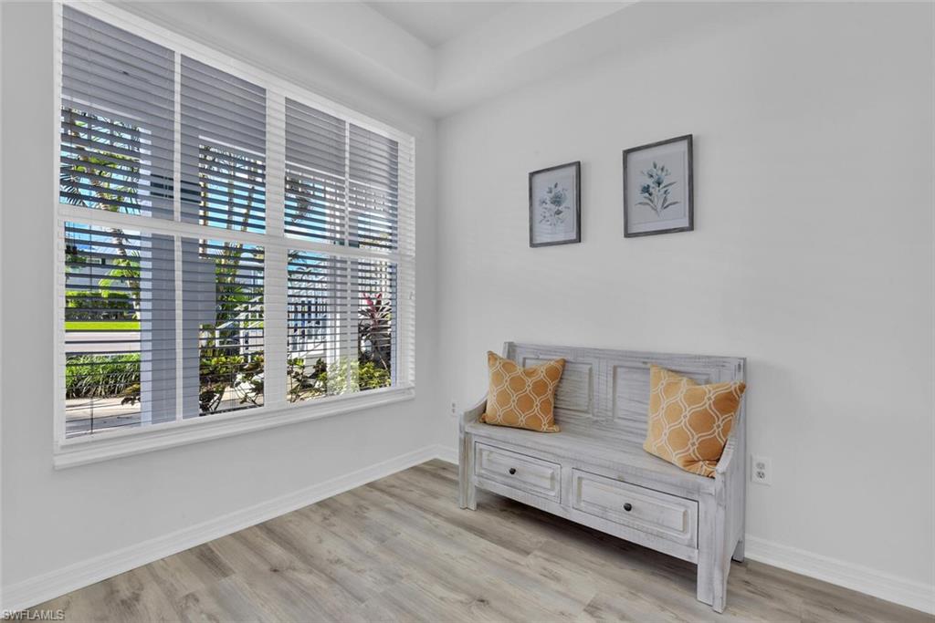 7895 Mahogany Run Lane, Unit 1416 Naples, FL 34113 - Photo 3 of 38 a room with baby crib and window