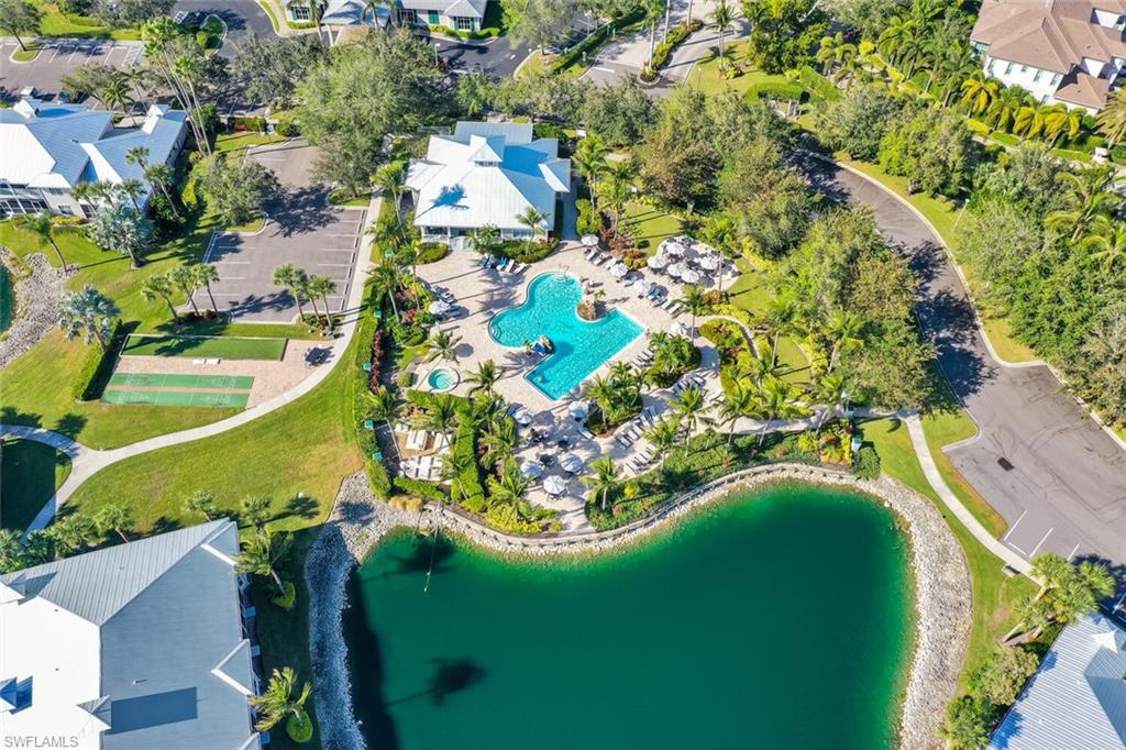7895 Mahogany Run Lane, Unit 1416 Naples, FL 34113 - Photo 31 of 38 view of a house with a yard and swimming pool