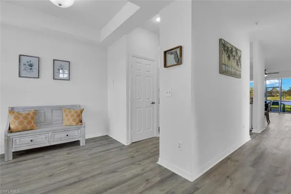 a view of room with furniture and wooden floor