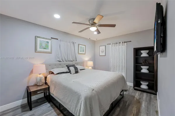a bedroom with bed and a window