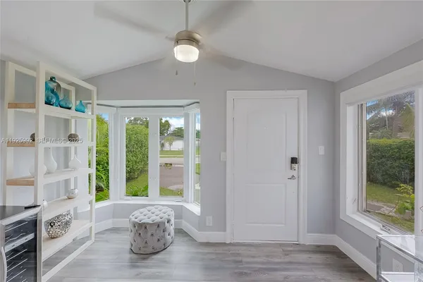 a living room with furniture and a large window