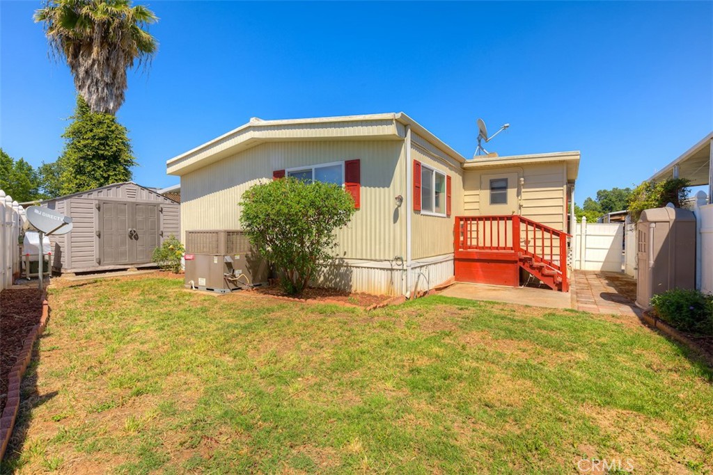 1901 Dayton Road, Unit 133 Chico, CA 95928 - Photo 28 of 36 a front view of a house with a yard and garage
