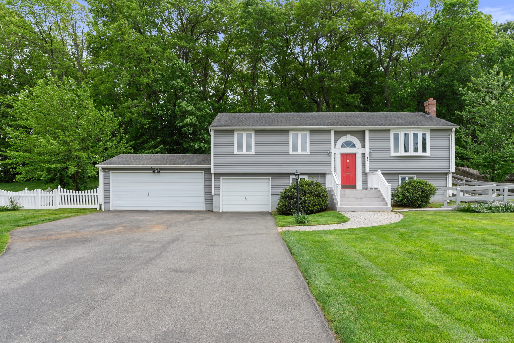 43 Worthington Road Glastonbury, CT 06033 - Photo 1 of 1 a front view of a house with a yard and garage