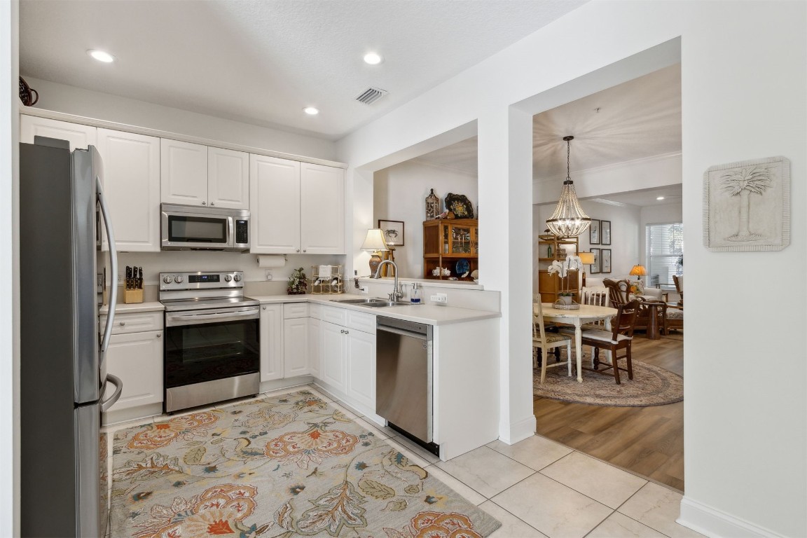 1824 Perimeter Park Road West Fernandina Beach, FL 32034 - Photo 6 of 24 a kitchen with granite countertop appliances cabinets and furniture