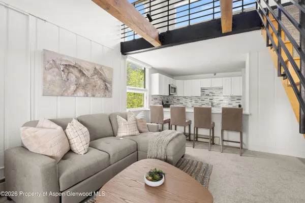 a living room with furniture and a window