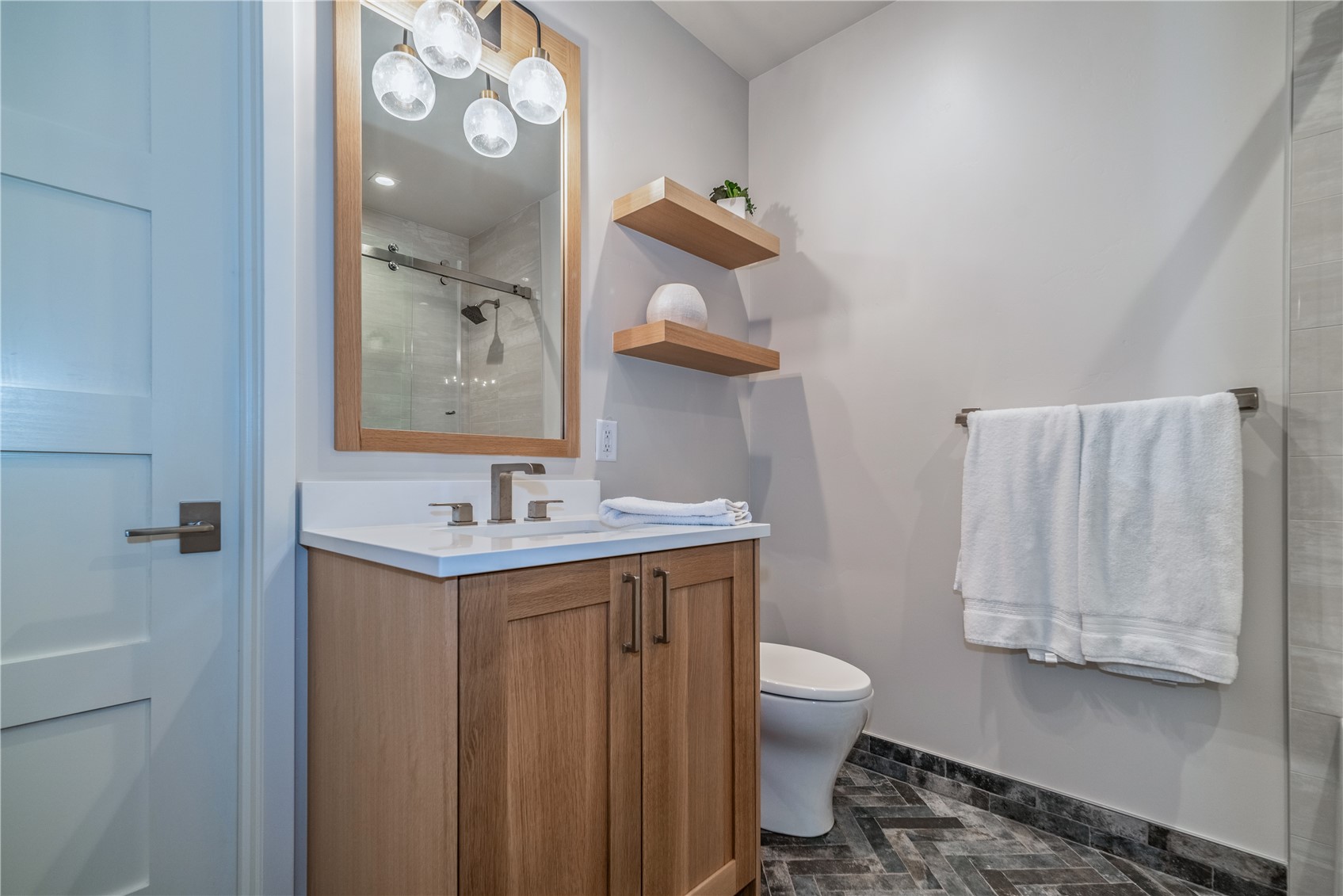 208 North Ridge Street Breckenridge, CO 80424 - Photo 17 of 35 a bathroom with a granite countertop sink toilet and mirror