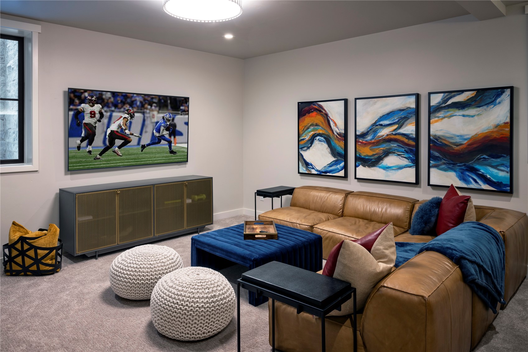 208 North Ridge Street Breckenridge, CO 80424 - Photo 33 of 35 a living room with furniture a rug and wall paintings