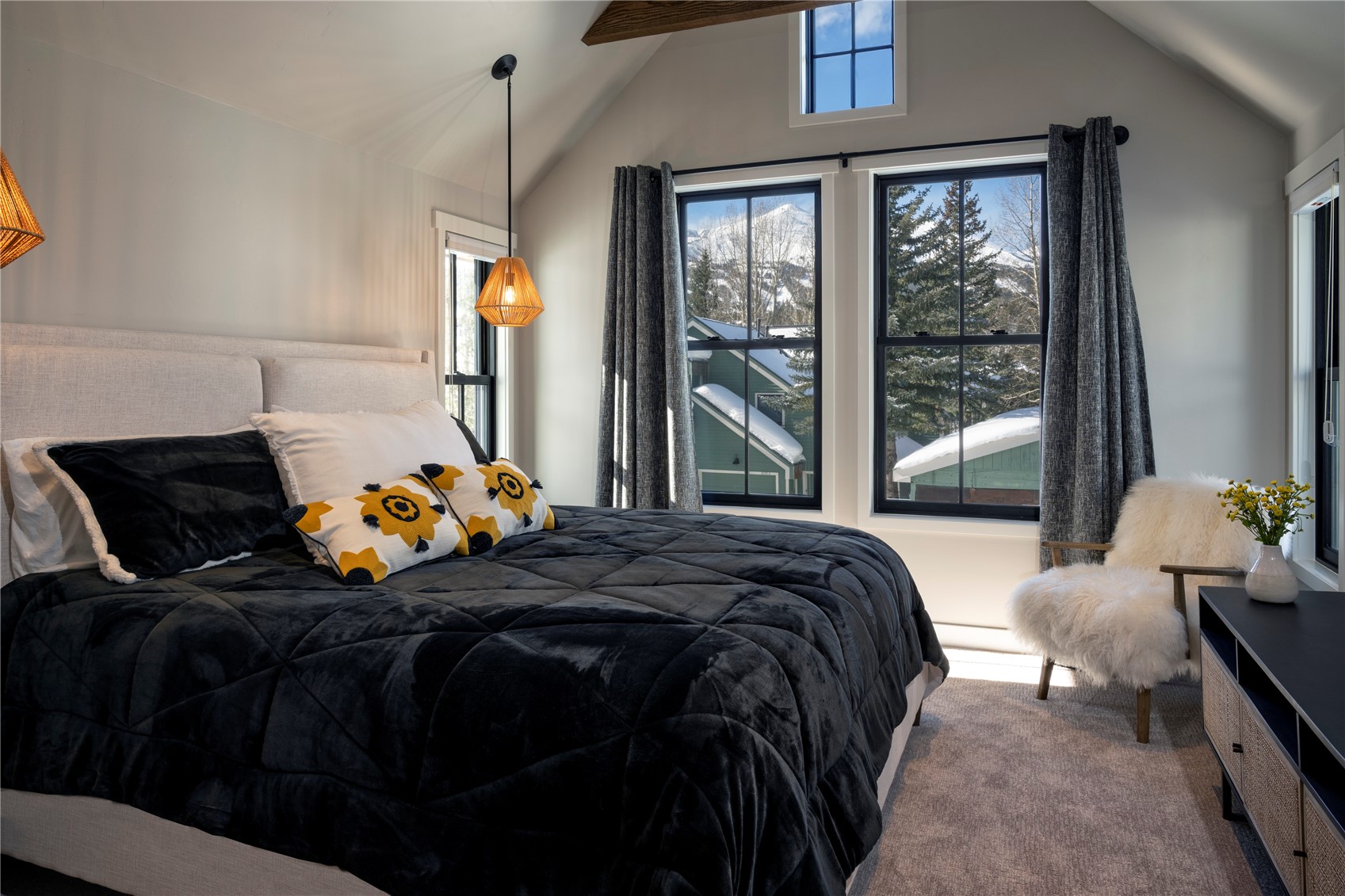 208 North Ridge Street Breckenridge, CO 80424 - Photo 4 of 35 a bed sitting in a bedroom next to a window