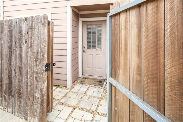 a view of a door and wooden floor