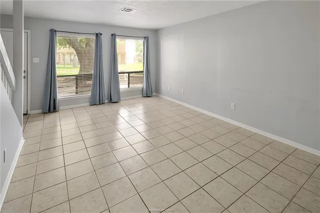 a view of an empty room and window