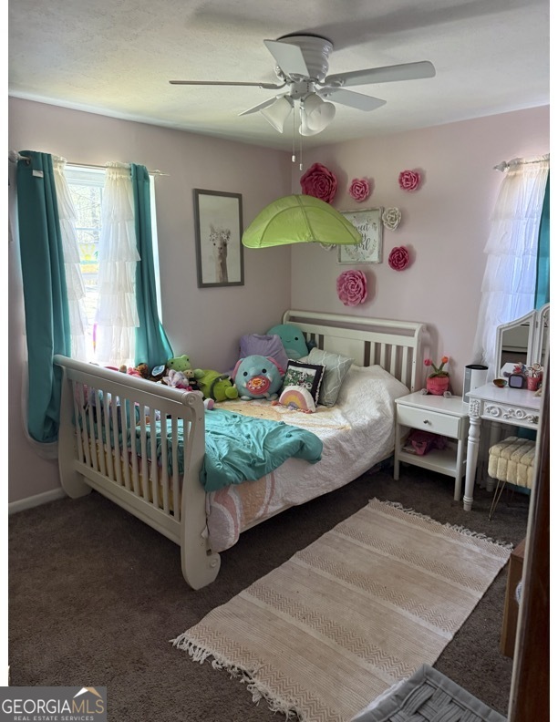 725 Strickland Town Road Luthersville, GA 30251 - Photo 13 of 18 a bedroom with a bed and a window