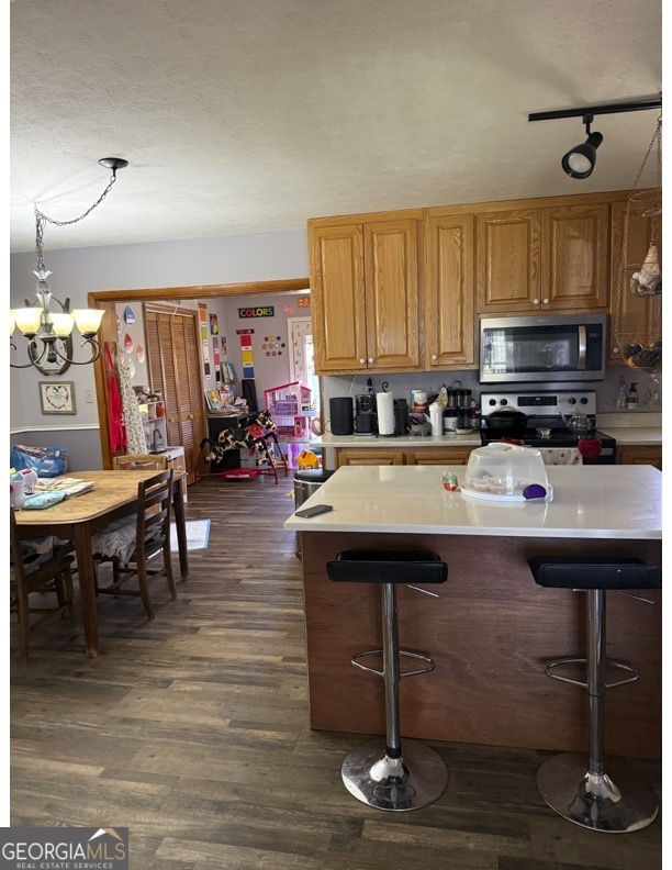 725 Strickland Town Road Luthersville, GA 30251 - Photo 3 of 18 a room with wooden floor table and chairs