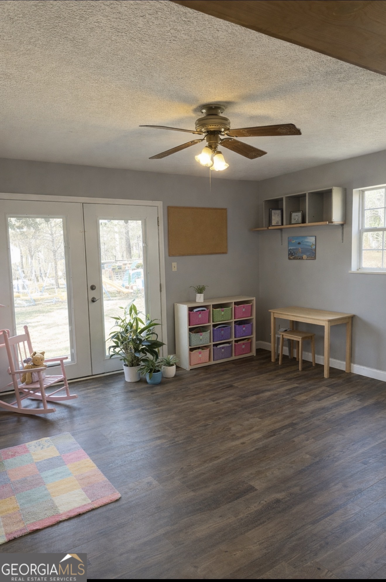 725 Strickland Town Road Luthersville, GA 30251 - Photo 5 of 18 a view of a livingroom with furniture a ceiling fan and window