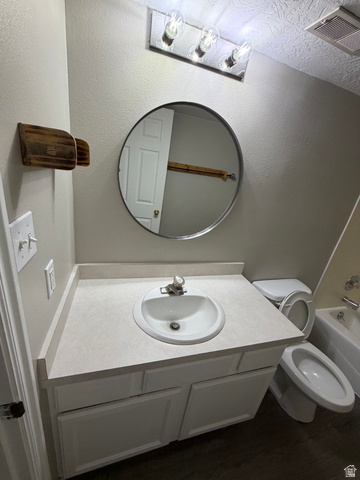 1563 South 600 East Springville, UT 84663 - Photo 22 of 30 Bathroom vanity featuring a white oval sink, light-toned countertop, and white cabinetry