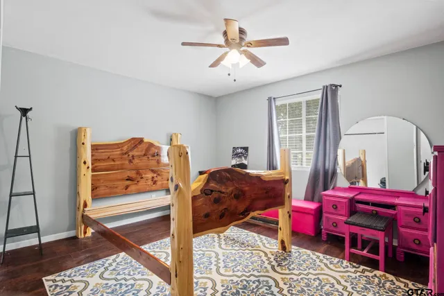 a living room with furniture a rug and a window