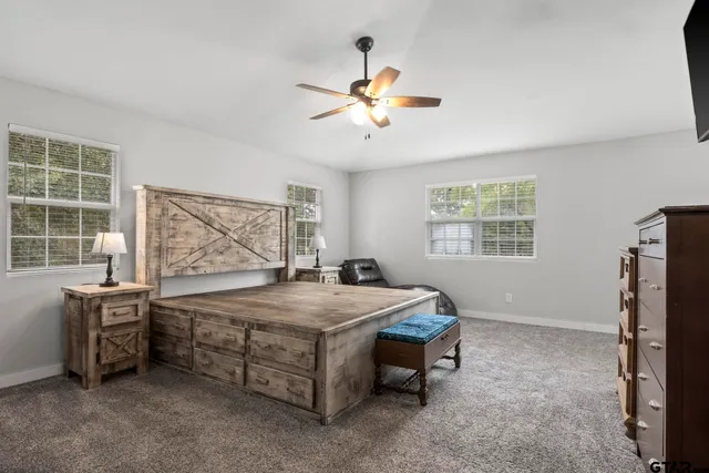 a bed room with a bed and a window