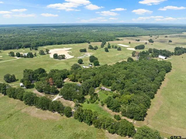 an aerial view of a houses with outdoor space