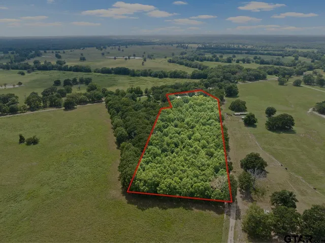 an aerial view of mountain with lake view