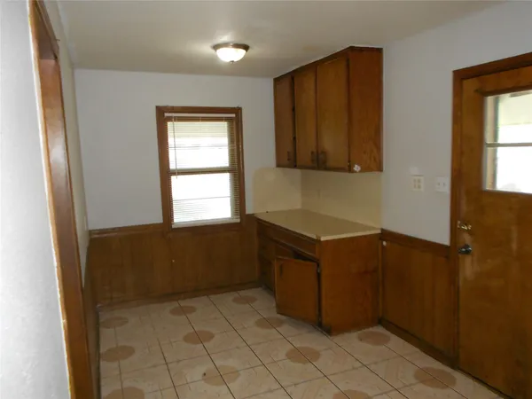a room with window and cabinet
